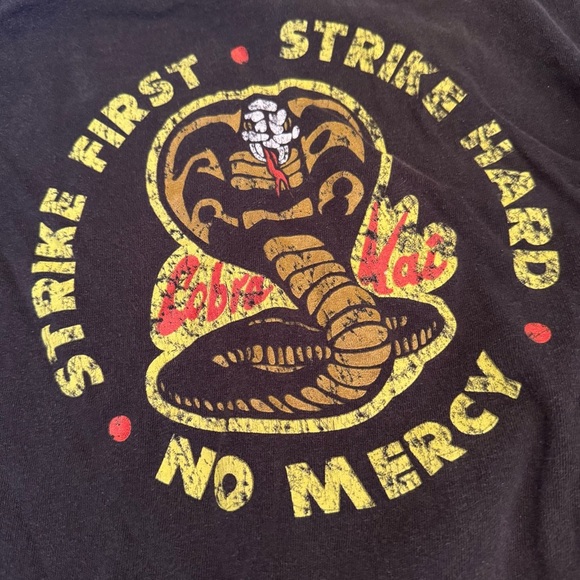 •COBRA KAI KARATE KID “STRIKE FIRST STRIKE HARD” UNISEX T-SHIRT - Picture 2 of 4